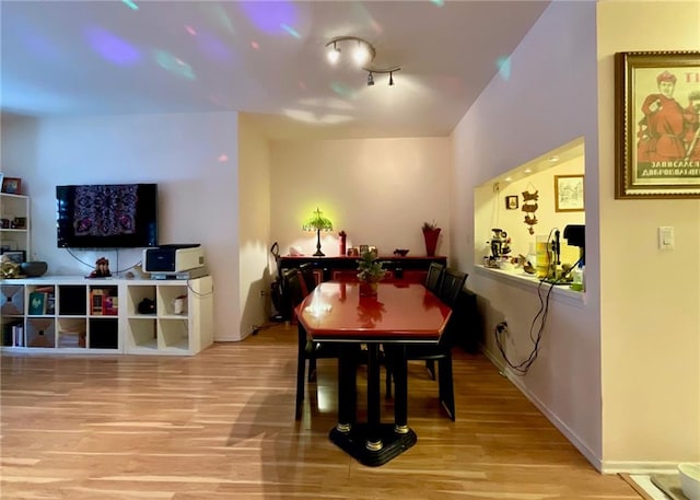 dining room with wood finished floors