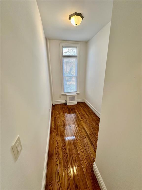 spare room featuring dark hardwood / wood-style floors