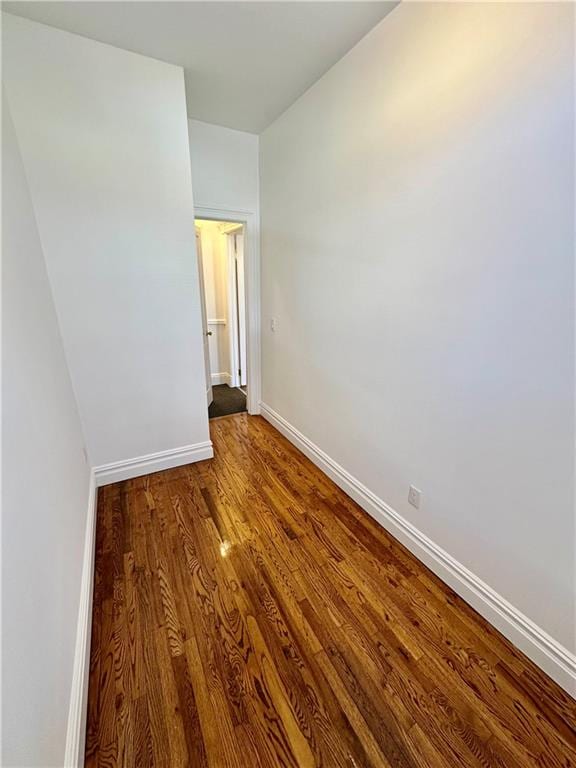 spare room featuring wood-type flooring