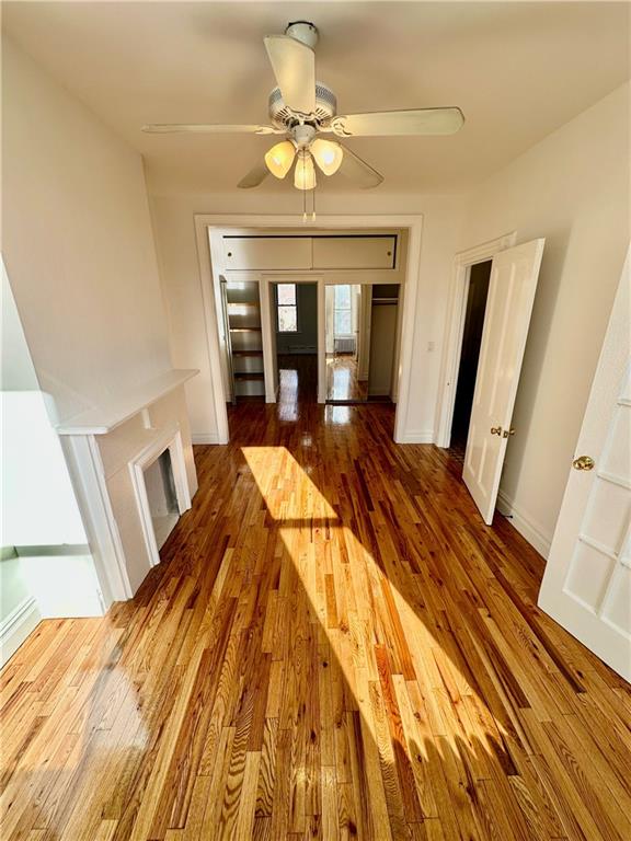 interior space with wood finished floors and baseboards