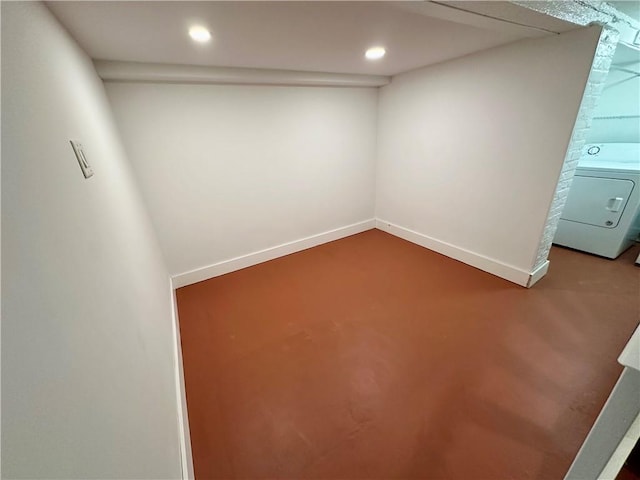 below grade area with baseboards, washer / clothes dryer, and recessed lighting