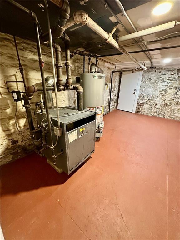 utility room featuring gas water heater