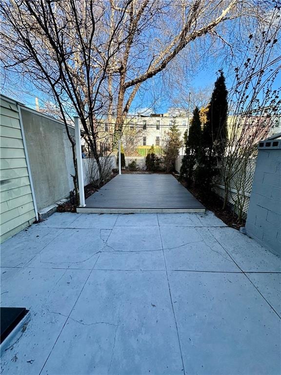 view of patio featuring fence