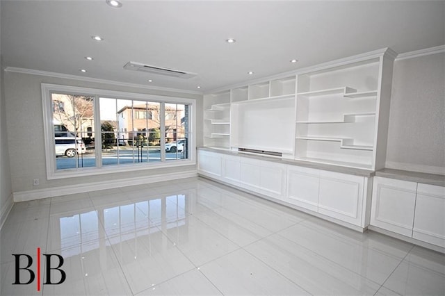 interior space featuring crown molding, recessed lighting, and baseboards