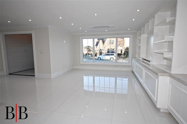 empty room featuring crown molding, recessed lighting, baseboards, and light tile patterned floors