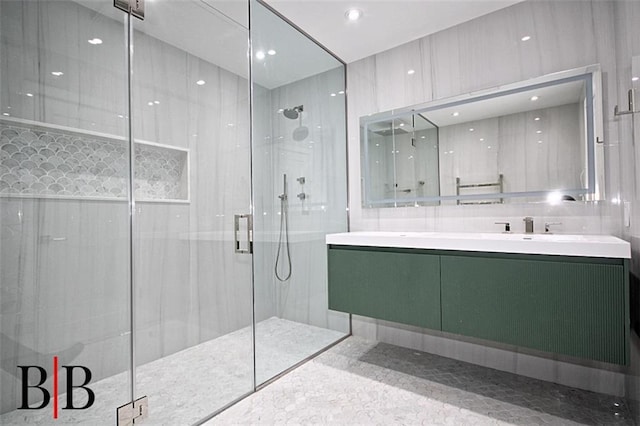 bathroom with vanity and a stall shower