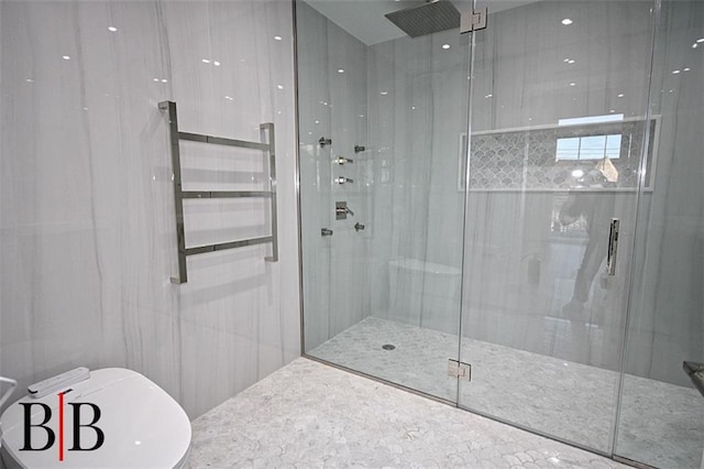 full bathroom with a stall shower and tile walls