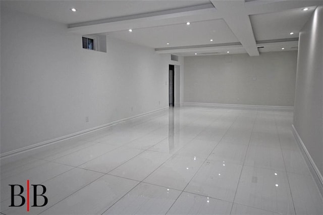 empty room with beam ceiling, light tile patterned floors, recessed lighting, and baseboards