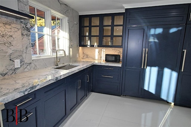 bar with a sink, light tile patterned floors, decorative backsplash, and black microwave