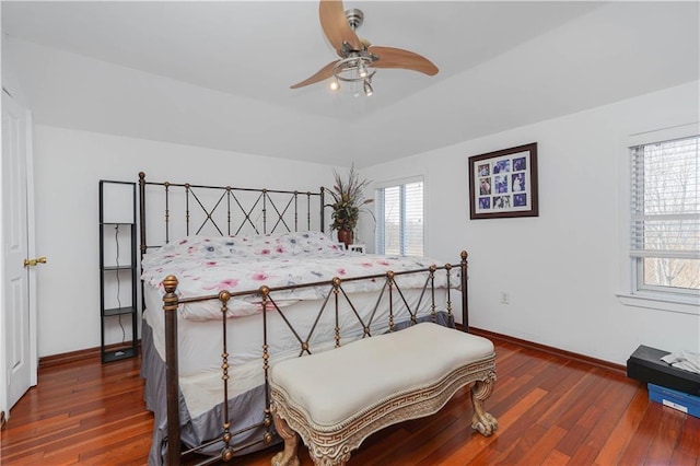 bedroom featuring ceiling fan, baseboards, and hardwood / wood-style floors