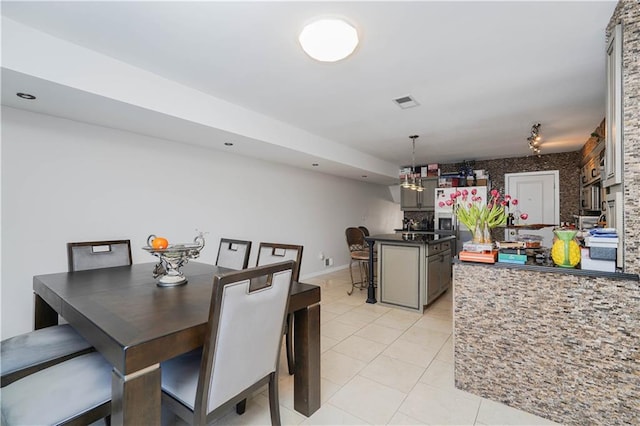 dining space featuring light tile patterned floors, recessed lighting, visible vents, and baseboards