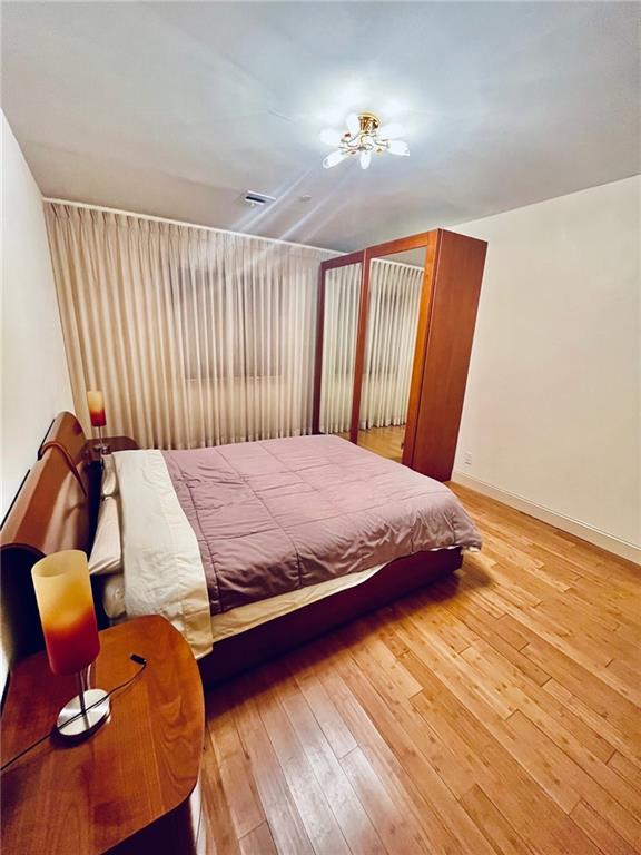 bedroom featuring light hardwood / wood-style floors