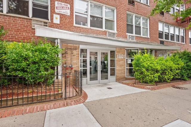 entrance to property with french doors and brick siding