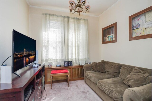 living room featuring light carpet, a chandelier, and ornamental molding