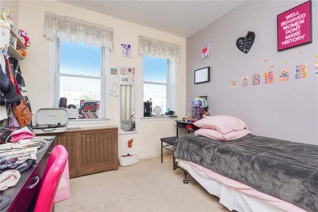 bedroom with light colored carpet