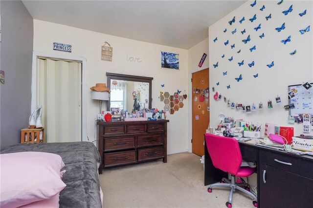 bedroom featuring light colored carpet