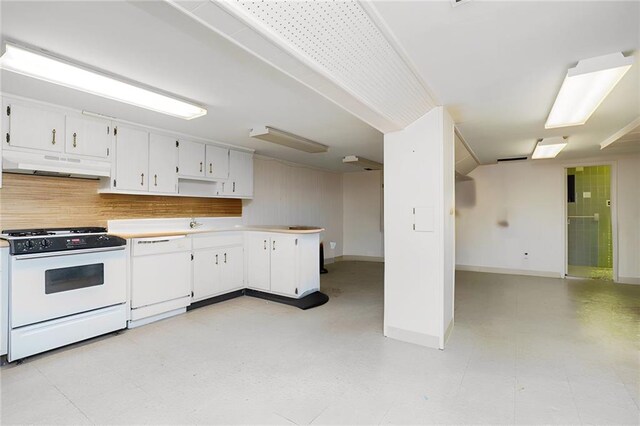 kitchen featuring decorative backsplash, white cabinets, and white appliances