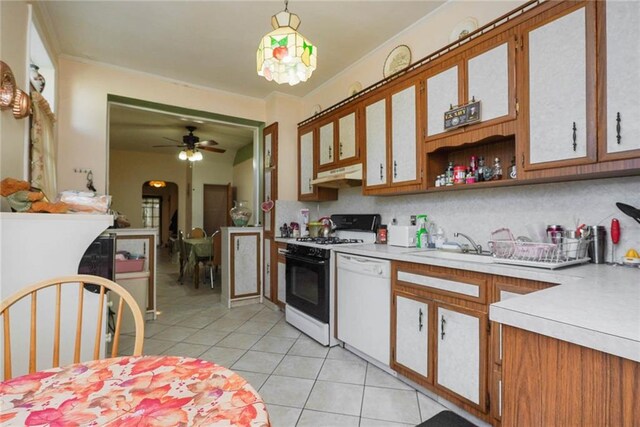 kitchen featuring pendant lighting, white appliances, decorative backsplash, ceiling fan, and light tile patterned floors