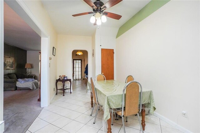 dining area with ceiling fan and light tile patterned floors