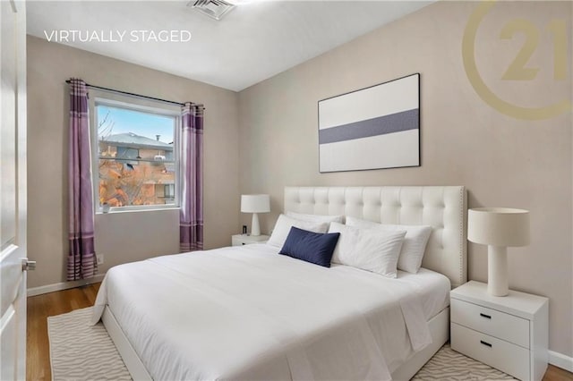 bedroom featuring light hardwood / wood-style floors