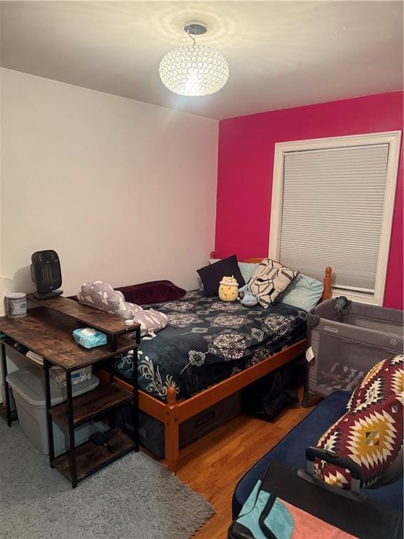 bedroom with wood finished floors