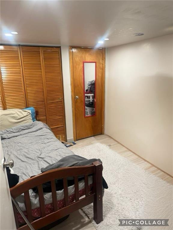 bedroom featuring light wood-type flooring and recessed lighting