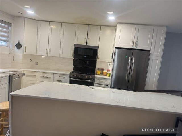 kitchen with tasteful backsplash, light stone countertops, stainless steel appliances, a kitchen bar, and recessed lighting