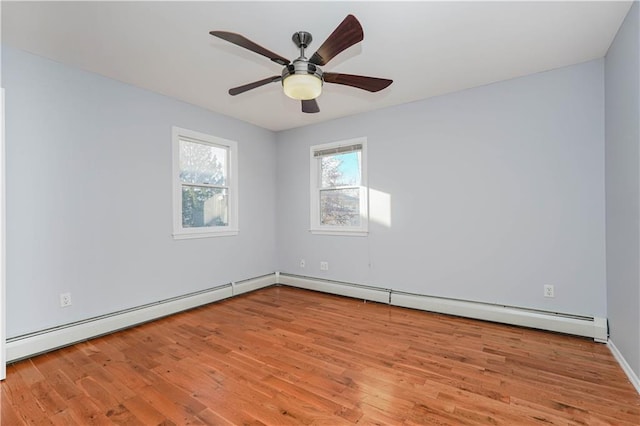 empty room with ceiling fan and wood finished floors