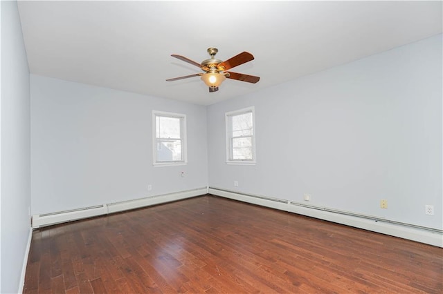 empty room with ceiling fan and wood finished floors