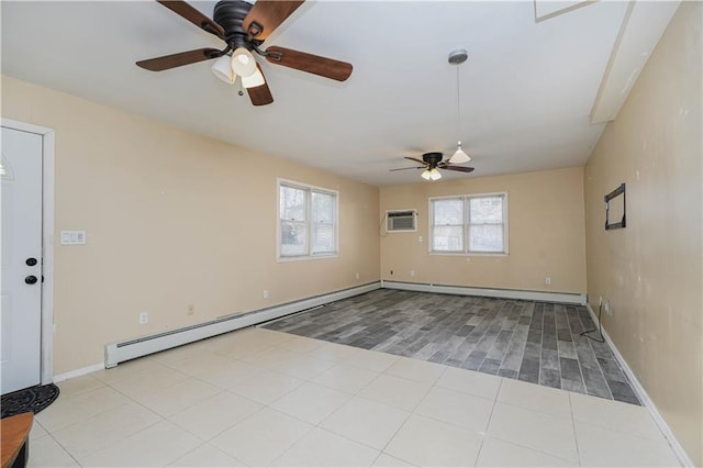 tiled empty room with a baseboard radiator, baseboards, and an AC wall unit