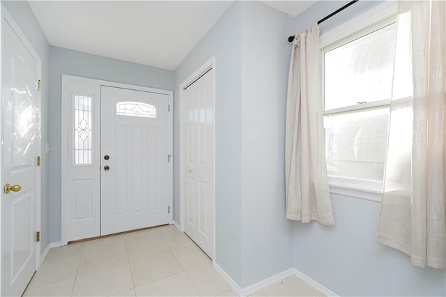 entryway featuring a healthy amount of sunlight and baseboards