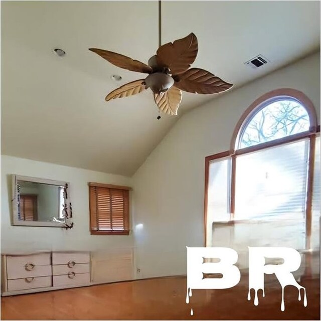 interior space featuring lofted ceiling and ceiling fan