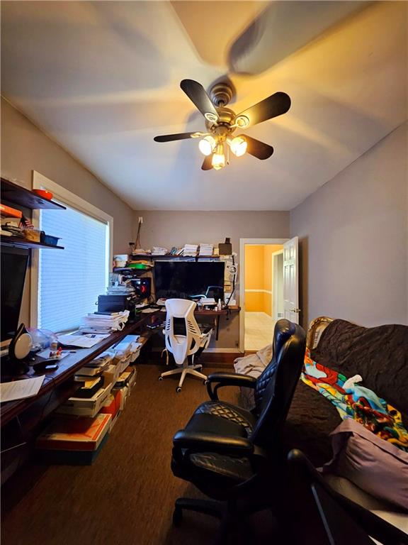 office area with ceiling fan