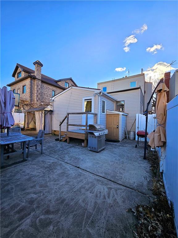 rear view of property with a patio area