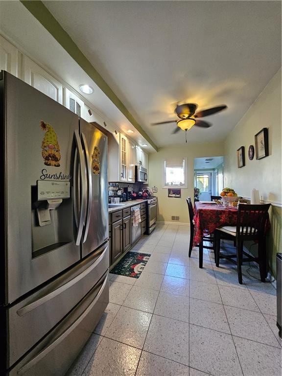 kitchen featuring appliances with stainless steel finishes and ceiling fan