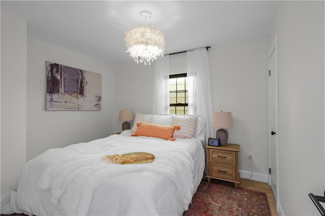 bedroom featuring a chandelier