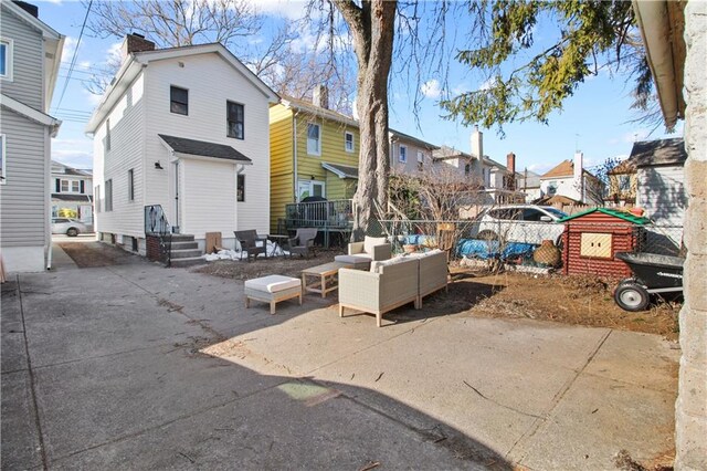 exterior space with an outdoor hangout area and a patio