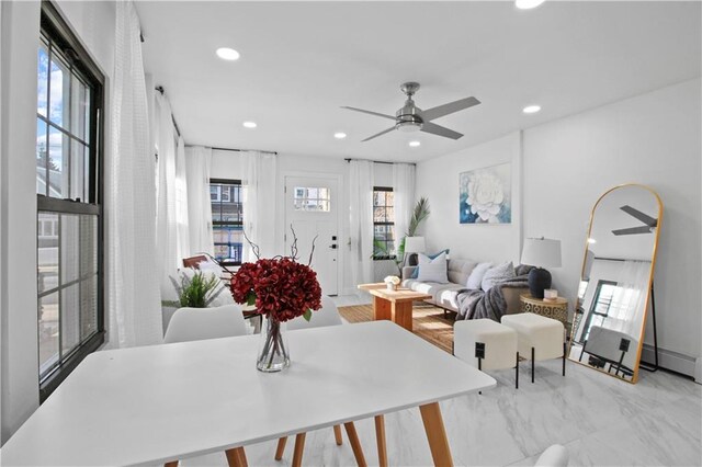 dining area with ceiling fan and a wealth of natural light