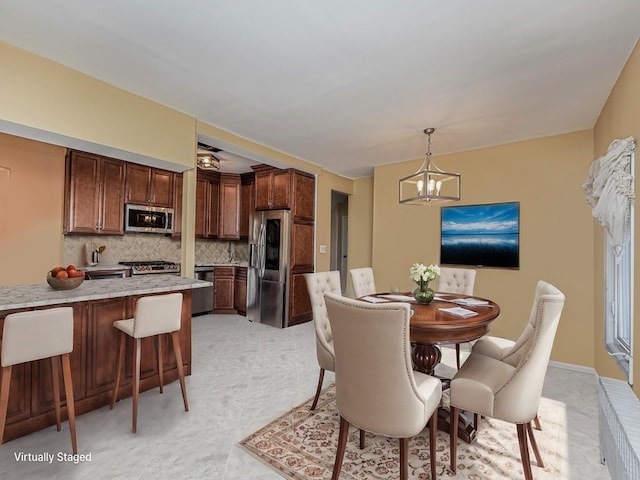 dining space featuring a chandelier