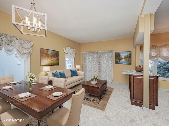 living room with an inviting chandelier