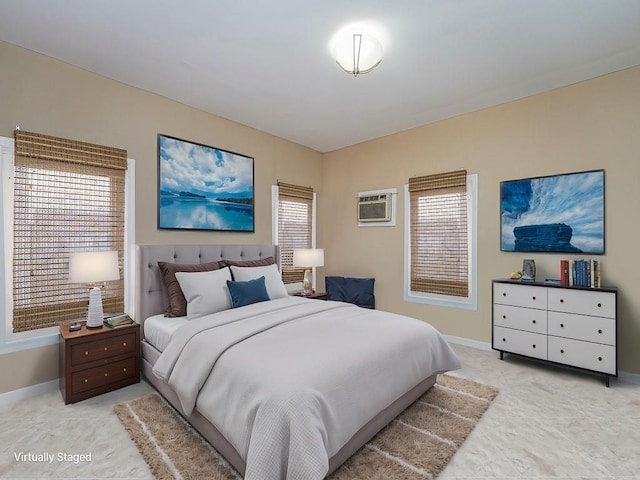 carpeted bedroom with a wall mounted air conditioner