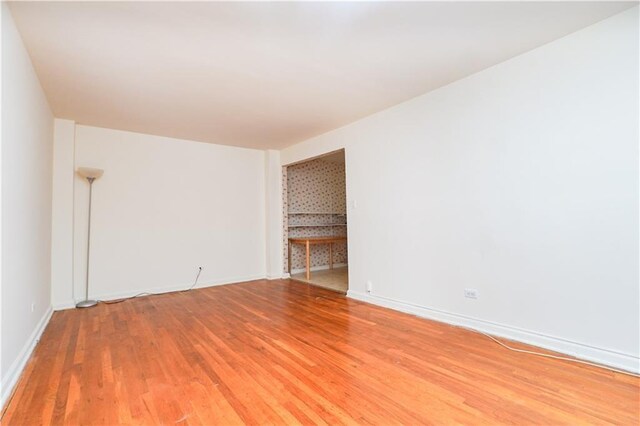 spare room featuring hardwood / wood-style floors