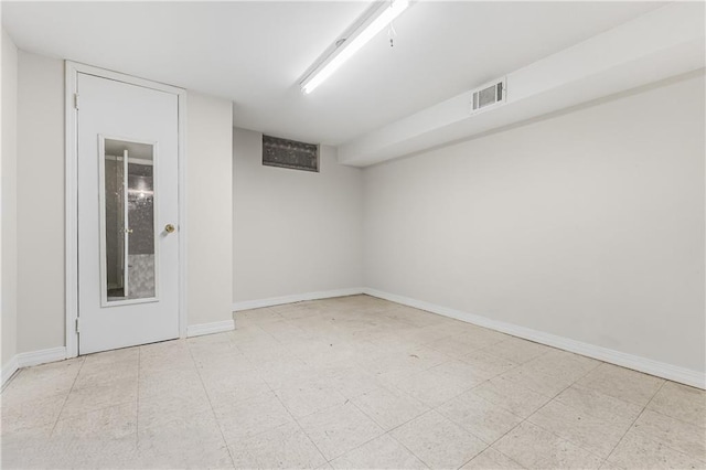 unfurnished room featuring tile patterned floors, baseboards, and visible vents