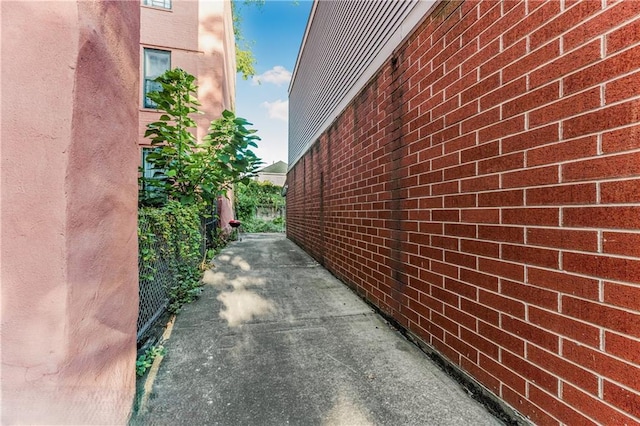 view of property exterior with brick siding