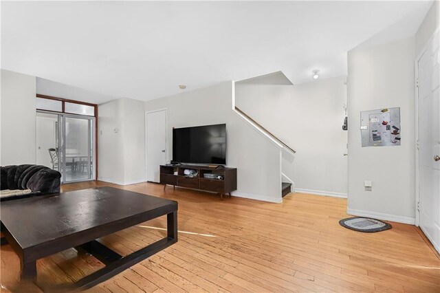 living room with light hardwood / wood-style flooring