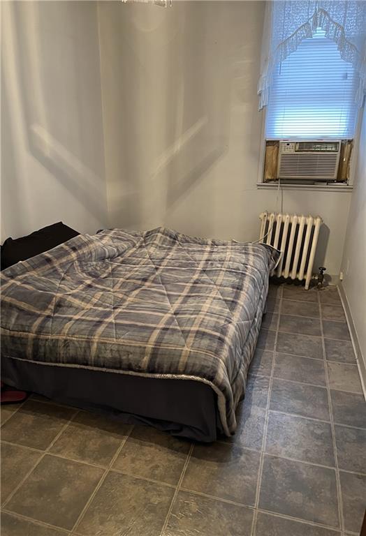 bedroom with radiator heating unit