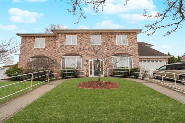 view of front of house with a front lawn and a garage