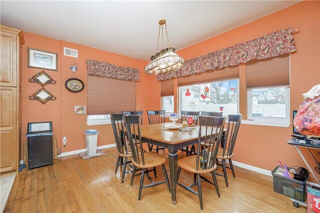 dining area with light wood-type flooring