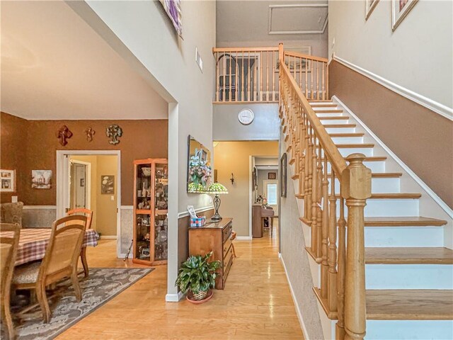 stairway with hardwood / wood-style floors