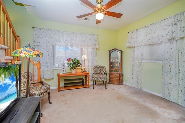 unfurnished room with ceiling fan and carpet flooring